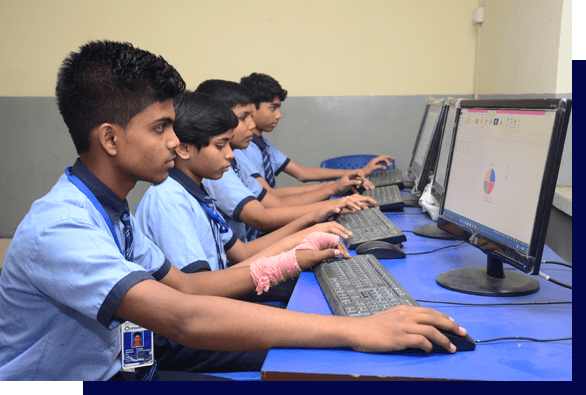 Gayathri pupils using desktop computers in the computer lab